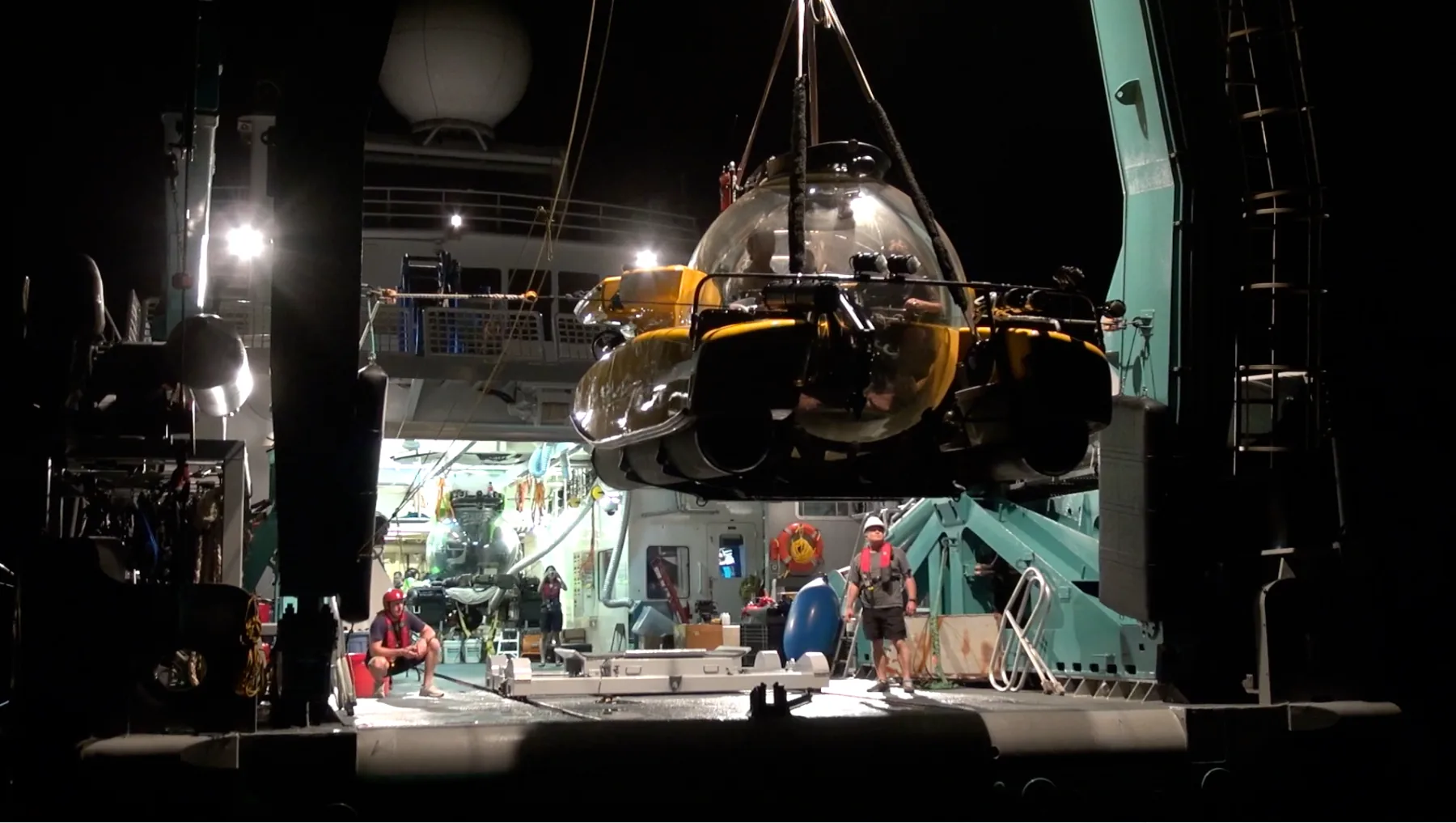 Submersibles at night aboard Alucia