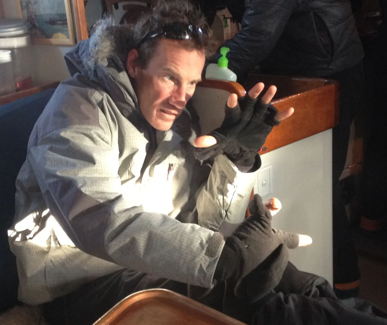 Kenneth Corben in cold weather aboard boat